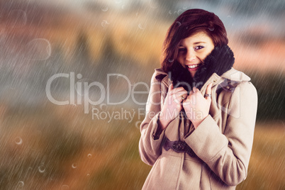 Composite image of portrait of beautiful woman in winter coat