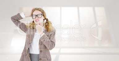 Composite image of geeky hipster thinking with hands on chin and