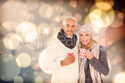 Composite image of portrait of happy couple drinking hot coffee