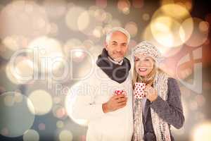 Composite image of portrait of happy couple drinking hot coffee