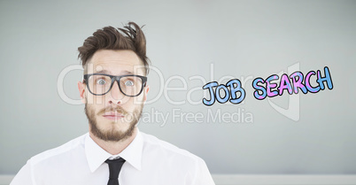 Composite image of geeky young businessman looking at camera