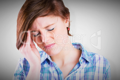 Composite image of pretty brunette getting a headache