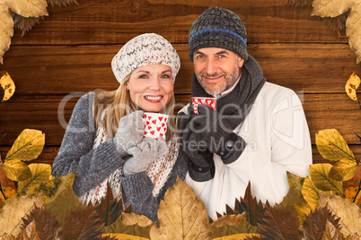 Composite image of portrait of couple drinking hot coffee