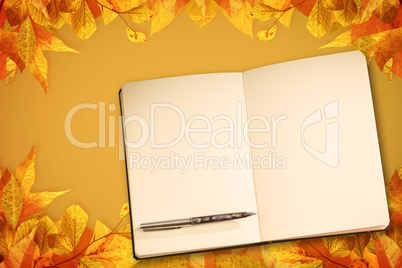 Composite image of notebook and pen