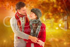 Composite image of smiling couple looking at each other