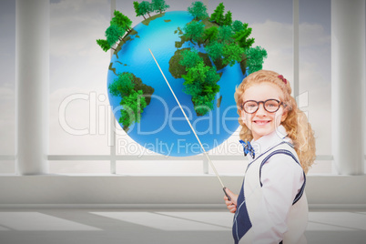 Composite image of happy pupil pointing the blackboard