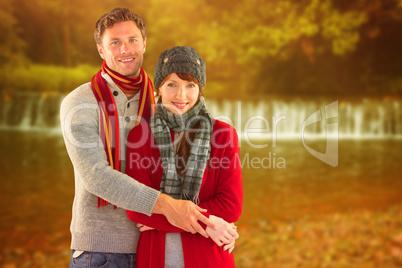 Composite image of couple holding and smiling together