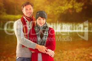 Composite image of couple holding and smiling together
