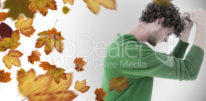 Composite image of depressed man over white background