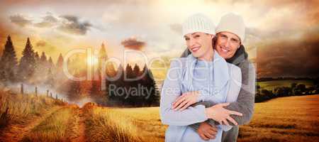 Composite image of casual couple in warm clothing