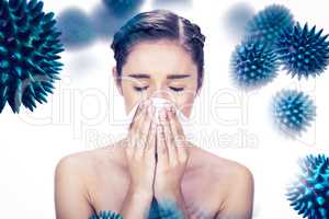 Composite image of sick young model blowing her nose