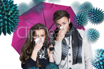 Composite image of couple blowing nose while holding umbrella