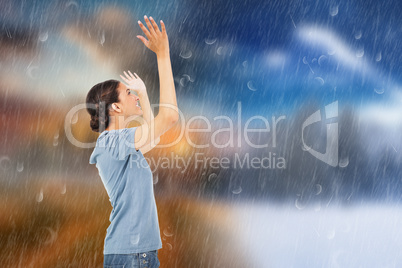 Composite image of pretty brunette cheering