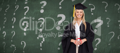 Composite image of smiling blonde student in graduate robe