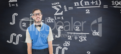 Composite image of geeky hipster pulling a silly face