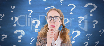 Composite image of geeky hipster woman thinking with hand on chi