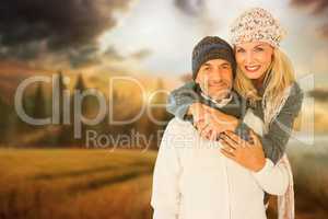Composite image of portrait of wife embracing husband