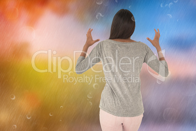 Composite image of brunette gesturing