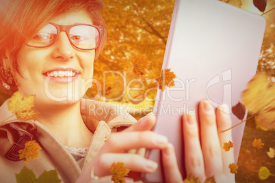 Composite image of portrait of smiling woman in glasses using ta