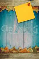 Composite image of digital image of pushpin on yellow paper