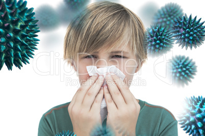 Composite image of sick little boy with a handkerchief