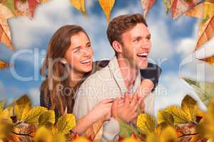 Composite image of cheerful young couple embracing