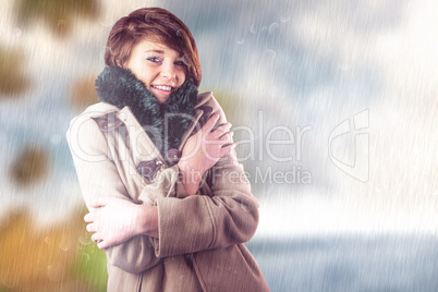 Composite image of portrait of beautiful woman in winter coat