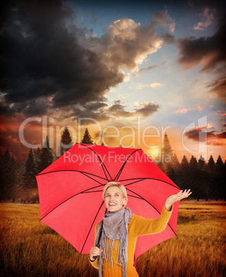 Composite image of woman checking to see if its raining