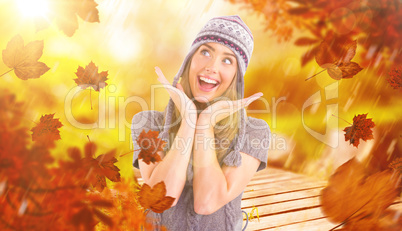 Composite image of happy blonde in winter clothes posing