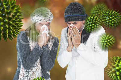Composite image of couple sneezing in tissue