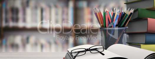 Composite image of school supplies on desk