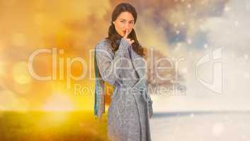 Composite image of young model with winter clothes keeping secre