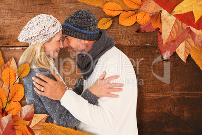 Composite image of smiling cute couple romancing over white back