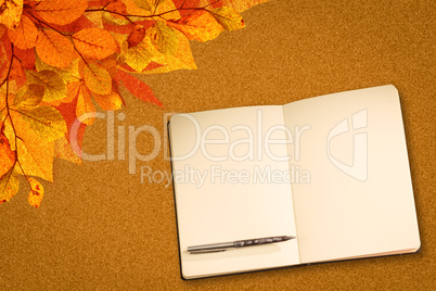 Composite image of notebook and pen