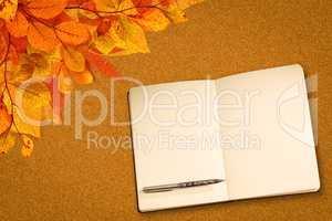 Composite image of notebook and pen