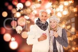 Composite image of portrait of happy couple drinking hot coffee