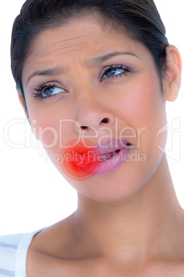 Composite image of beautiful woman licking lips while looking aw