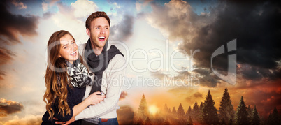 Composite image of happy young couple embracing