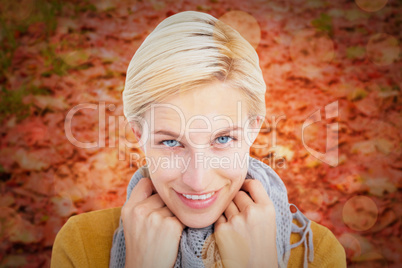 Composite image of smiling woman wearing a scarf