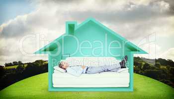 Composite image of businessman lying on sofa