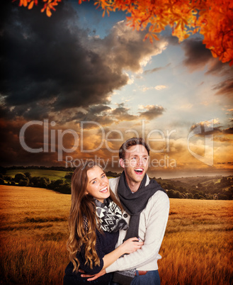 Composite image of happy young couple embracing