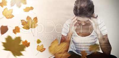 Composite image of pretty brunette with head on hands