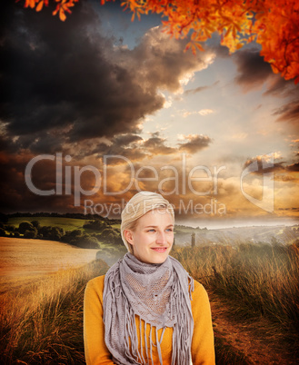 Composite image of smiling woman wearing a scarf