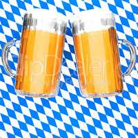 Two filled beer glasses on Bavarian flag