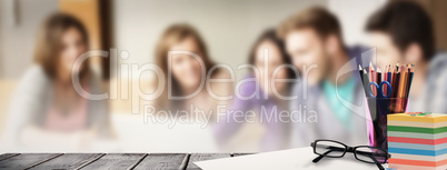 Composite image of school supplies on desk