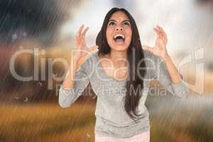 Composite image of angry brunette shouting