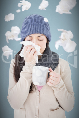 Composite image of sick brunette blowing her nose while holding