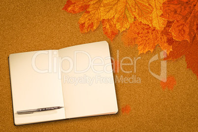 Composite image of notebook and pen