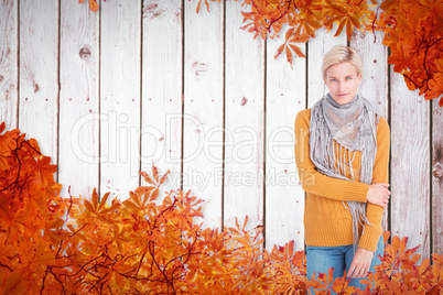 Composite image of smiling woman looking at the camera