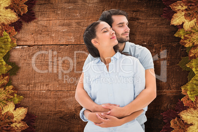 Composite image of cute couple embracing with eyes closed